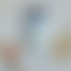 Framed sign reading "today is more than enough" with colorful patterns, on a paint-splattered surface beside a black paintbrush.