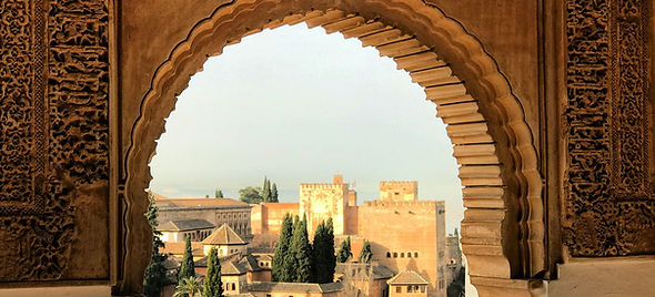 View from Nasrid Palaces - Panoramic vista of Albaicín's white maze and Darro Valley below