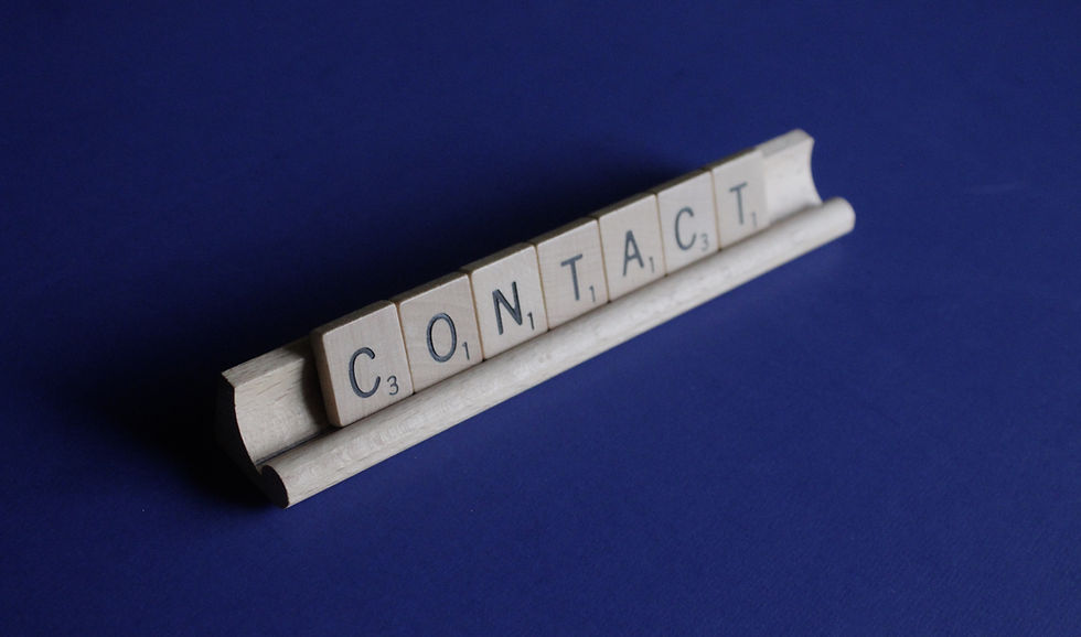 contact spelled out in scrabble pieces