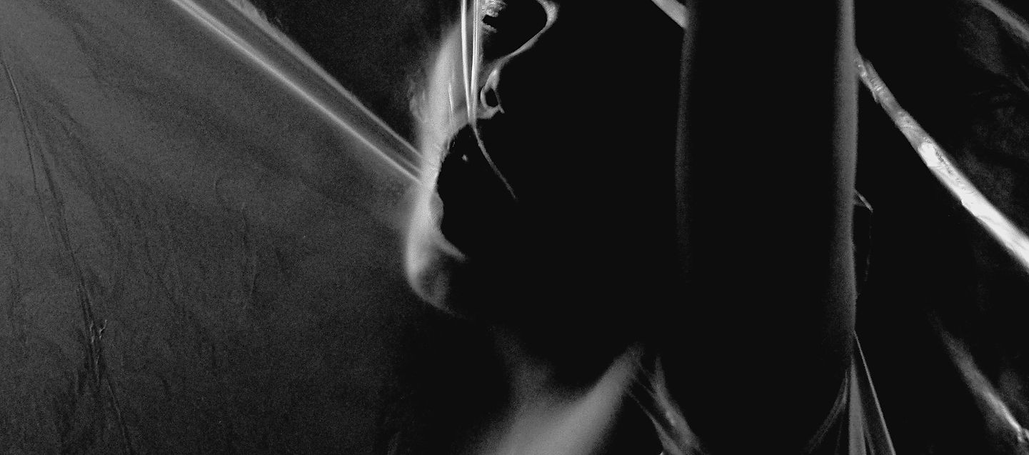 A split black and white photo of hands, symbolising emotional division and relationship polarisation.