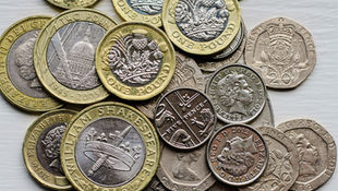 A pile of coins from different currencies