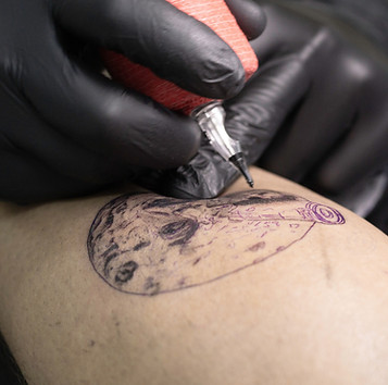 tattooing arm