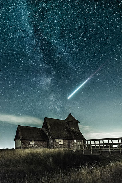 Silhouette gazing up at a shooting star, symbolising the calling of wanderers from beyond the stars