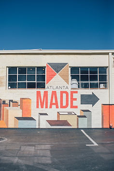 A mural on the side of a building that says atlanta made