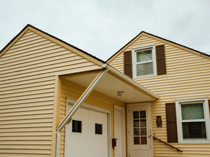 Roof and siding combo project completed on Pittsburgh area home showing coordinated materials and professional installation