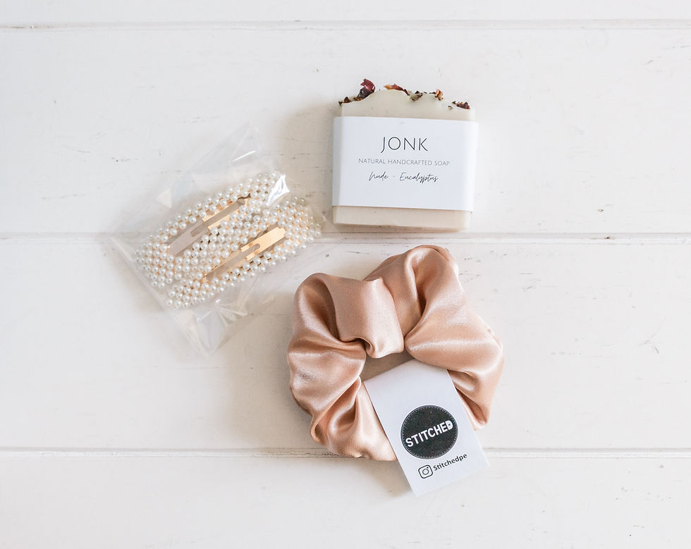 pink satin scrunchie, two pretty pearl barrettes and a soap