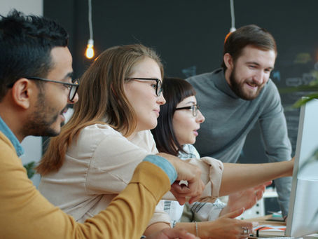 HR leader and diverse team discussing personalized employee benefits options