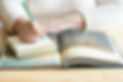 A woman over 40 journaling after Sacred Rituals Sundays.