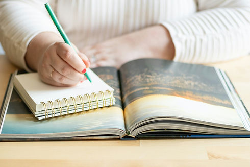 A woman over 40 journaling after Sacred Rituals Sundays.