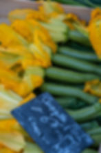 Basket of zucchini with flowers on