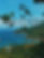View from a high viewpoint showing the deep green mountainous coastline and the deep blue ocean in Ilhabela Brazil