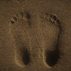 Feet relief in sand.