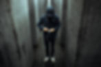 Man with black hoodie in maze