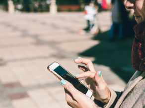 A person scrolling on their phone