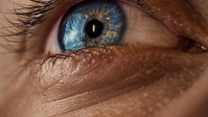 A close-up of a woman's eye in soft natural light, representing perimenopause dry eye disease and hormonal changes affecting the tear film during the menopausal transition from Vibrance Way