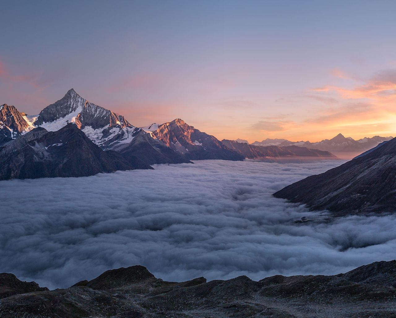 Mountains in the clouds at sunset