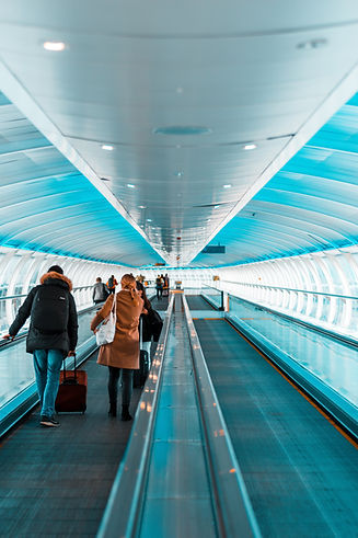 Passengers on moving walkway
