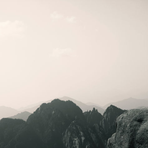 Silhouette of a mountain climber, misty background. Symbolic for the ambiguity of surrounding when in a place of anger, and the isolation it causes.