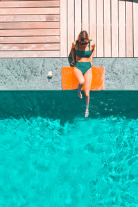 woman lounging poolside