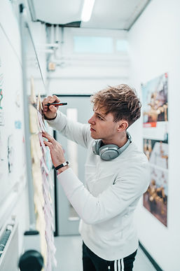 Focused young professional working on whiteboard