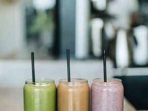 three smoothies with different colours and flavours