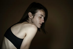 sad white woman in profile; image by Engin Akyrt