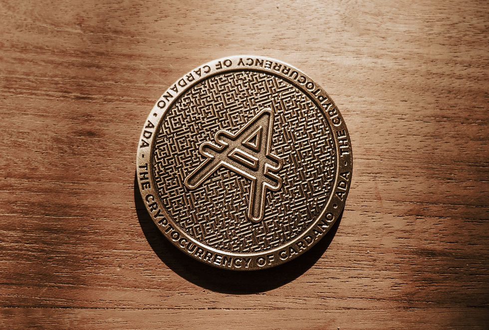 A Cardano (ADA) token displaying the ADA logo sits atop a wooden surface