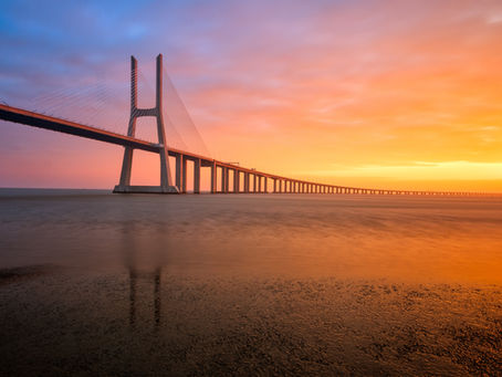Sunlit bridge overlooking a peaceful landscape symbolizing acceptance, emotional healing, resilience, and renewal