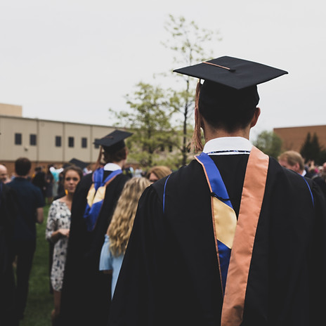 Image by Charles DeLoye | Group of college graduates on school grounds.
