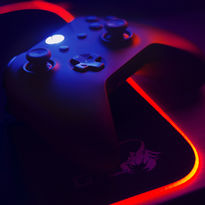 Gaming controller lit by red and blue RGB lights