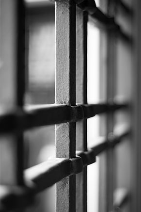 Image showing prison bars to signfiy Millington Hingley's involvement in Appeal Cases