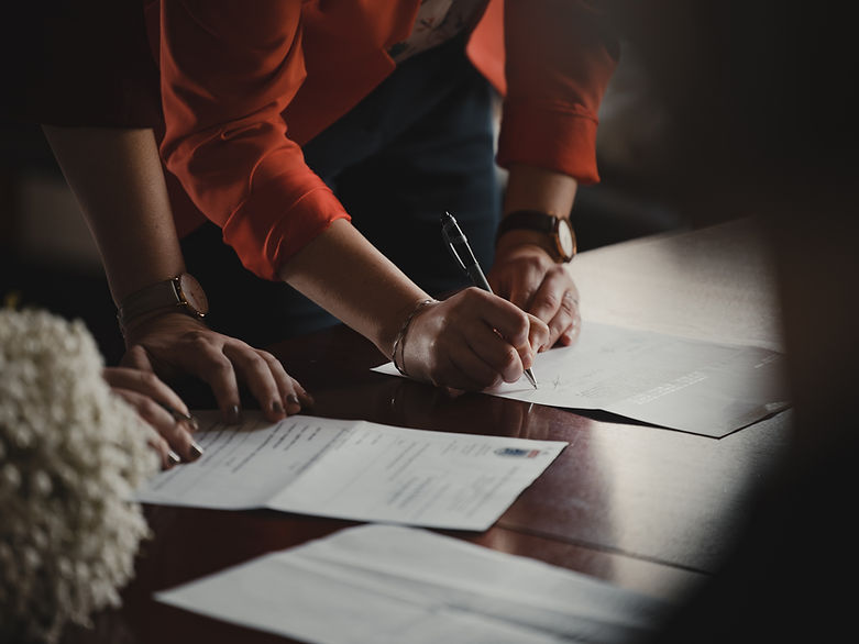 Hand signing a document