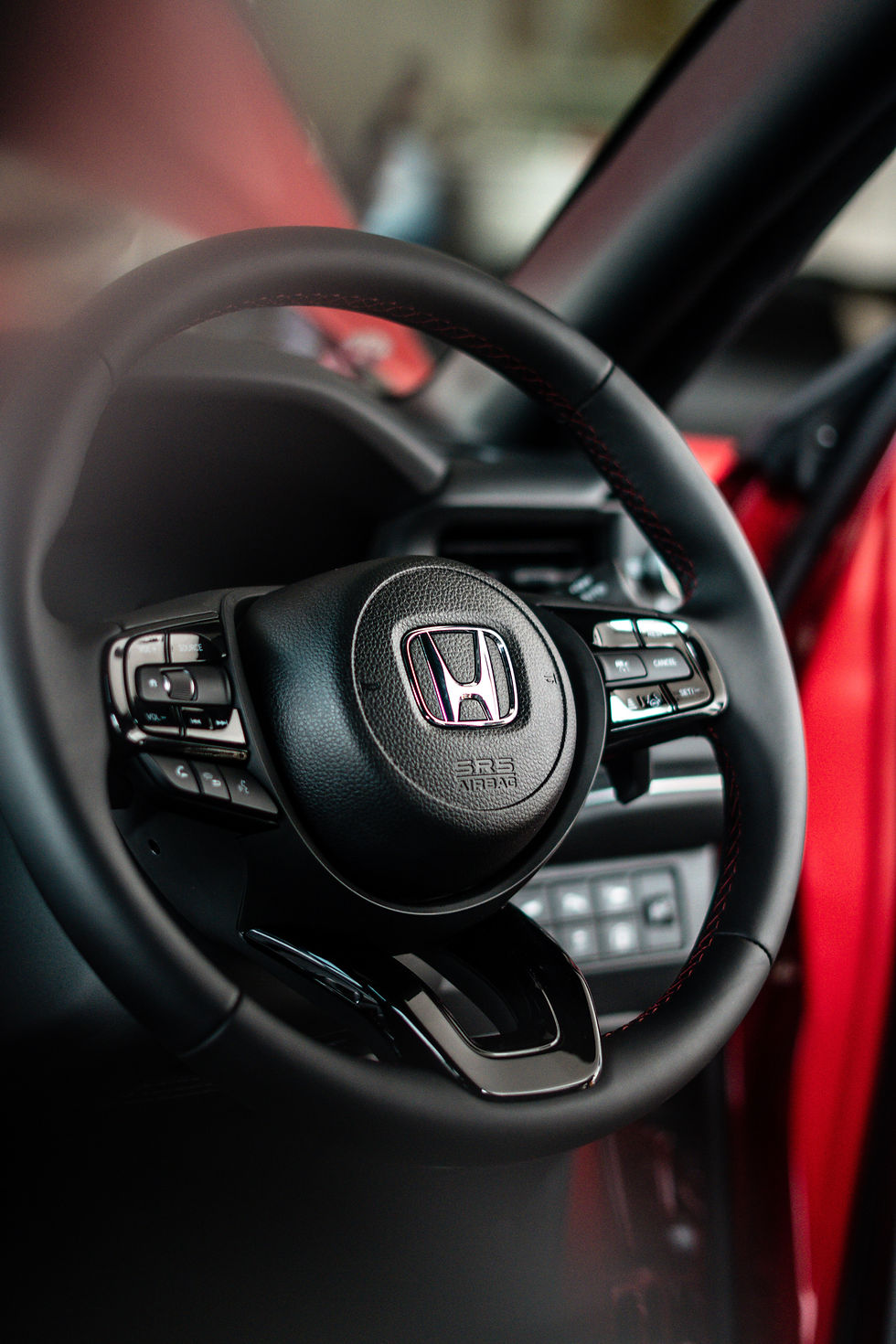 Honda black steering wheel and dashboard