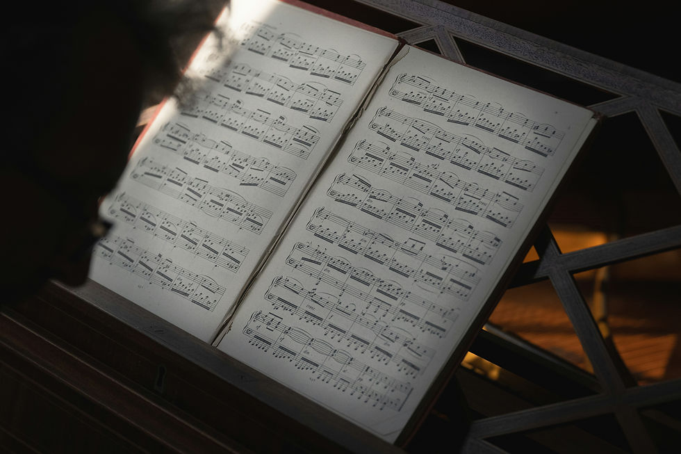 Eye-level view of sheets of harpsichord music on a stand