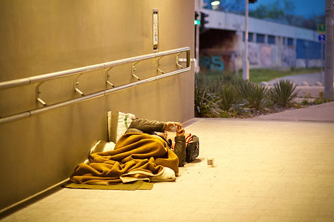 a person lying on the side of the street