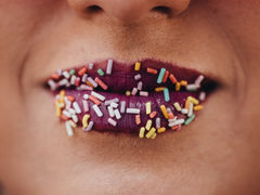Lips covered in hundreds and thousands