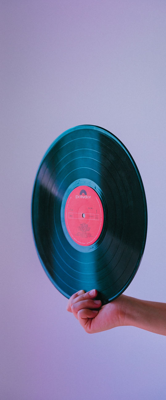 Fresh natural manicure holding vinyl music record