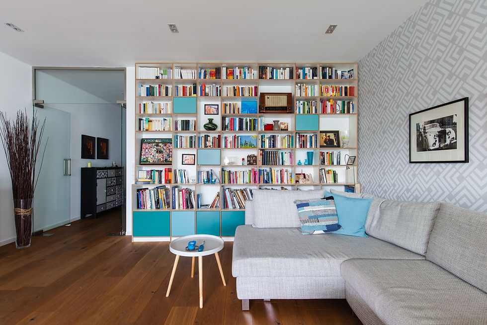 Floor to ceiling bookcase moves the eye up creating a feeling of high ceilings