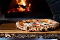 Woodfired pizza nights and food at Top of the Woods .An award winning nature-based holiday retreat offering luxury glamping and eco camping in Pembrokeshire, Wales. One of the best dog-friendly sites for slow travel and wild escapes in the UK.