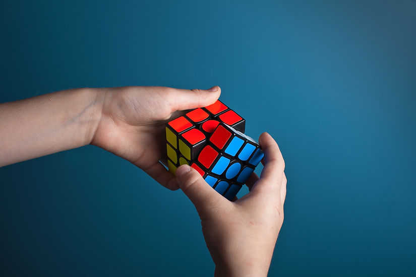 hand turning a Rubik's cube