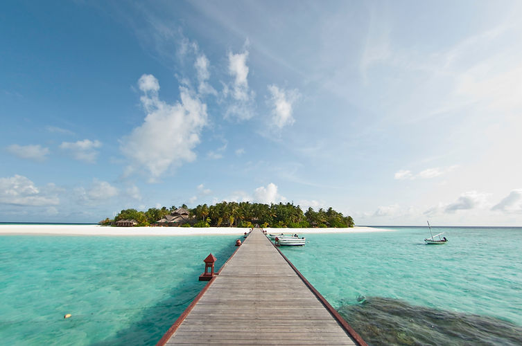 Tropical Island with Boats and Jeti - Image by Jackie Tsang
