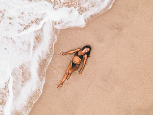 woman laying on the beach