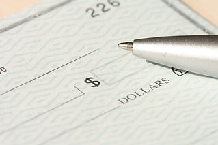 Muted background of checkbook check and pen