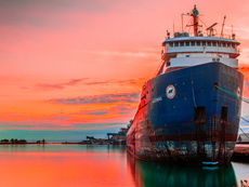 Vessel at port at sunset