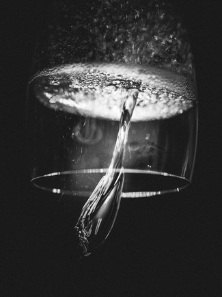 black and white photo of upside down champagne glass