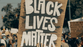 A protestor holds up a Black Lives Matter sign