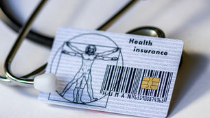 Health insurance cost breakdown illustration showing a health insurance card next to a stethoscope representing medical coverage, premiums, deductibles, coinsurance, and out-of-pocket maximum costs in healthcare planning.