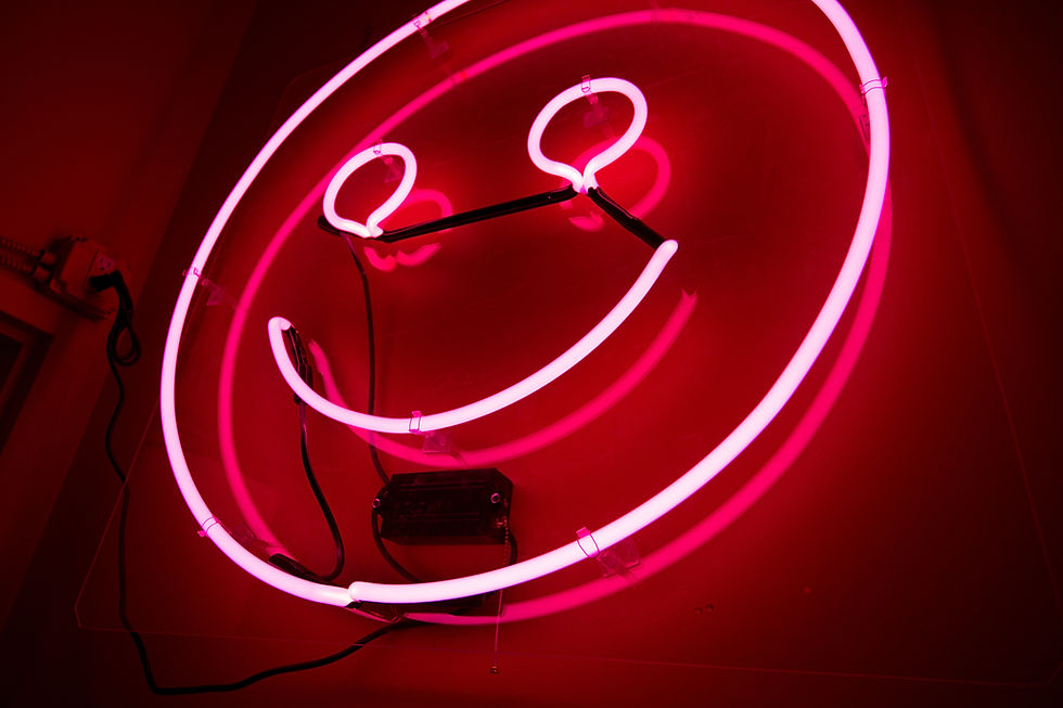 red neon smiley face sign