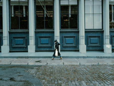A person walking through an urban street