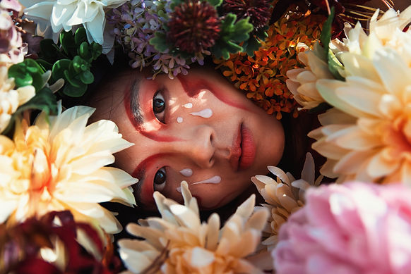 girl surrounded in flowers